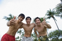 Three men with arms around each other, smiling at camera - Asia Images Group