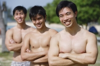 Three shirtless men with arms crossed - Asia Images Group