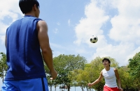Two men playing soccer - Asia Images Group