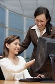 Female executives looking at computer - Asia Images Group