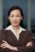 Businesswoman with arms crossed, portrait - Asia Images Group