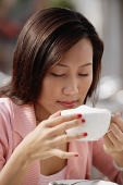 Woman drinking cappuccino - Asia Images Group