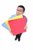 Businessman carrying  multi coloured folders - Asia Images Group