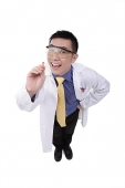 Doctor in lab coat pointing with pencil - Asia Images Group