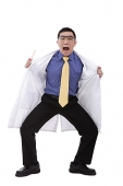 Doctor in lab coat flashing camera - Asia Images Group