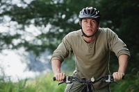 Man on a bicycle - Asia Images Group