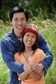 Couple embracing, smiling at camera - Asia Images Group