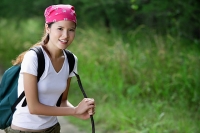 Female hiker smiling at camera - Asia Images Group