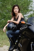 Young woman on motorcycle - Asia Images Group