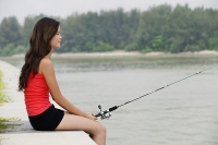 Woman fishing - Asia Images Group