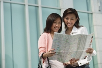 Two women looking at map - Asia Images Group