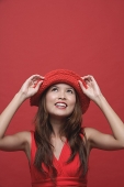 Woman with red hat, smiling - Asia Images Group