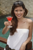 Woman with cocktail in hand, portrait - Asia Images Group