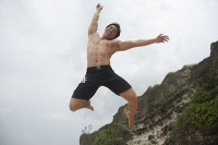 Man jumping in air - Asia Images Group