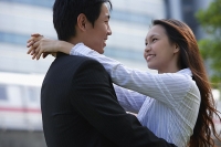 Couple looking at each other, embracing - Asia Images Group