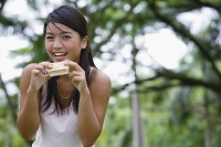 Young woman eating ice cream - Asia Images Group