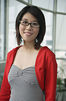Woman with black eyeglasses, looking at camera - Asia Images Group