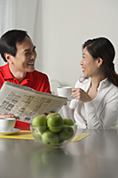 Mature couple at home having coffee - Asia Images Group