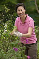 Mature woman working in garden - Asia Images Group