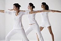 Three woman in lunge posture, yoga - Asia Images Group
