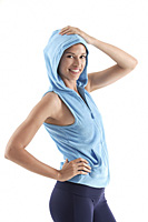 Woman smiling looking at camera, wearing a hooded vest - Asia Images Group