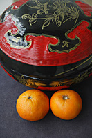 Chinese wedding basket with Mandarin Oranges, high angle view - Asia Images Group