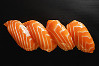 Four pieces of Salmon Sushi, nigiri on rice ball - Asia Images Group