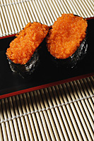 2 pieces of sushi, Tobiko Gunkan, fish roe - Asia Images Group