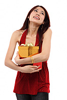 Young woman holding two presents, looking up - Asia Images Group