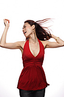 Young woman dancing, hair blowing - Asia Images Group