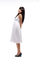 Young girl wearing white dress, side view - Asia Images Group