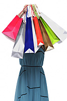 Young woman holding shopping bags in front of face - Asia Images Group