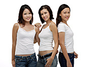 Three Young women standing and looking at camera, smiling - Asia Images Group