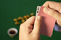 A man playing cards - Asia Images Group