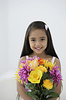 A young girl with a bunch of flowers - Asia Images Group