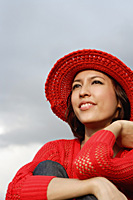 A woman with a red hat and top - Asia Images Group