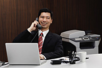 A businessman on the telephone - Asia Images Group