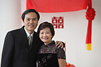 A couple smile at the camera - Asia Images Group