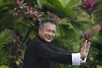 Man practicing Tai Chi in the park - Asia Images Group