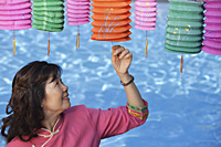 Woman with Chinese lanterns - Asia Images Group