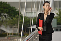 Businesswoman talking on the mobile phone - Asia Images Group