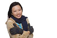 Woman freezing and smiling at camera - Asia Images Group
