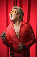 Man in hip hop outfit having fun - Asia Images Group