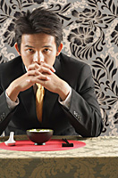 Man having meal at restaurant - Asia Images Group