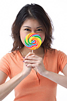 Young woman with lollipop looking at camera - Asia Images Group