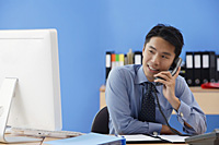 Businessman talking on the phone - Asia Images Group
