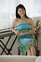 Young woman relaxing at keyboard - Asia Images Group