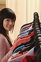 Young woman shopping for clothes - Asia Images Group