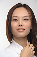 Young woman in bathrobe smiling at camera - Asia Images Group