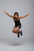Young woman jumping up - Asia Images Group